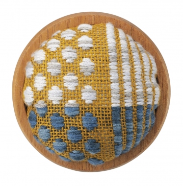Pin cushion with wooden bowl.